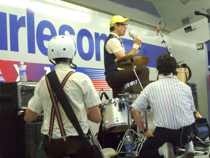 Photo of band members performing